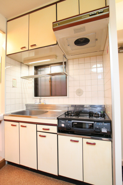 Kitchen. Two-burner gas stove installed already, Storage rack, With window