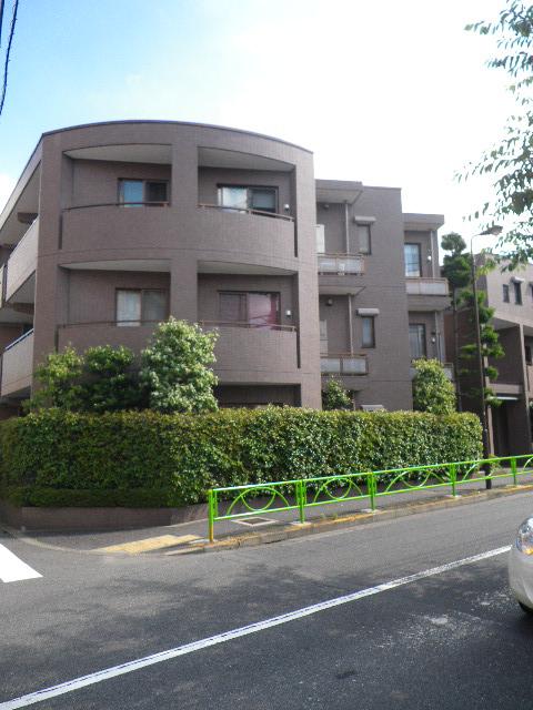 Local appearance photo.  [appearance] Low-rise apartment nestled in a quiet residential area