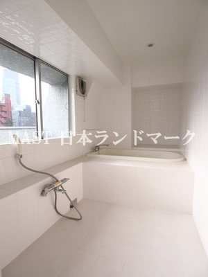 Bath. White tile is water around the bright atmosphere