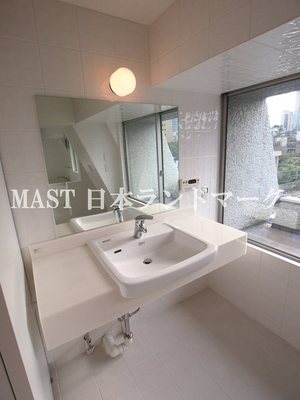 Washroom. It is bright and stylish atmosphere