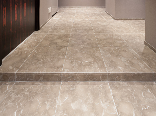 Interior.  [Natural stone floor] Entrance, Adopt a natural stone that can feel calm is in the hallway of the floor. Elegant color, It will produce a feeling of luxury pattern of natural materials. (Model Room W-130X type)