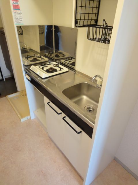 Kitchen. It comes with a gas stove.