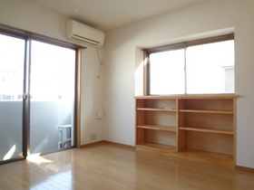 Living and room. With storage shelves under the bay window