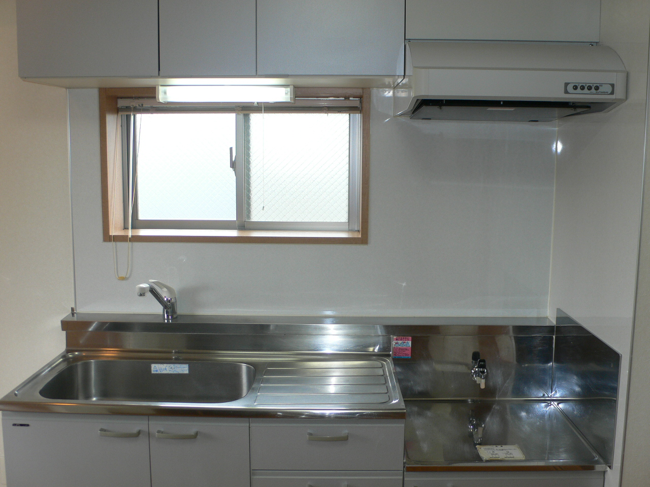 Kitchen. There is a window.