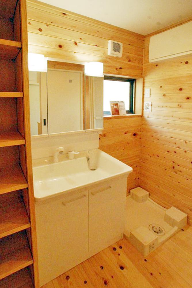 Wash basin, toilet. Storage is also built-in vanity