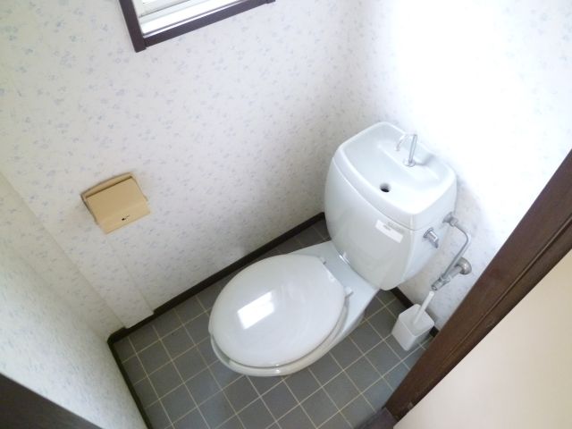 Toilet. There is also a window to the toilet.