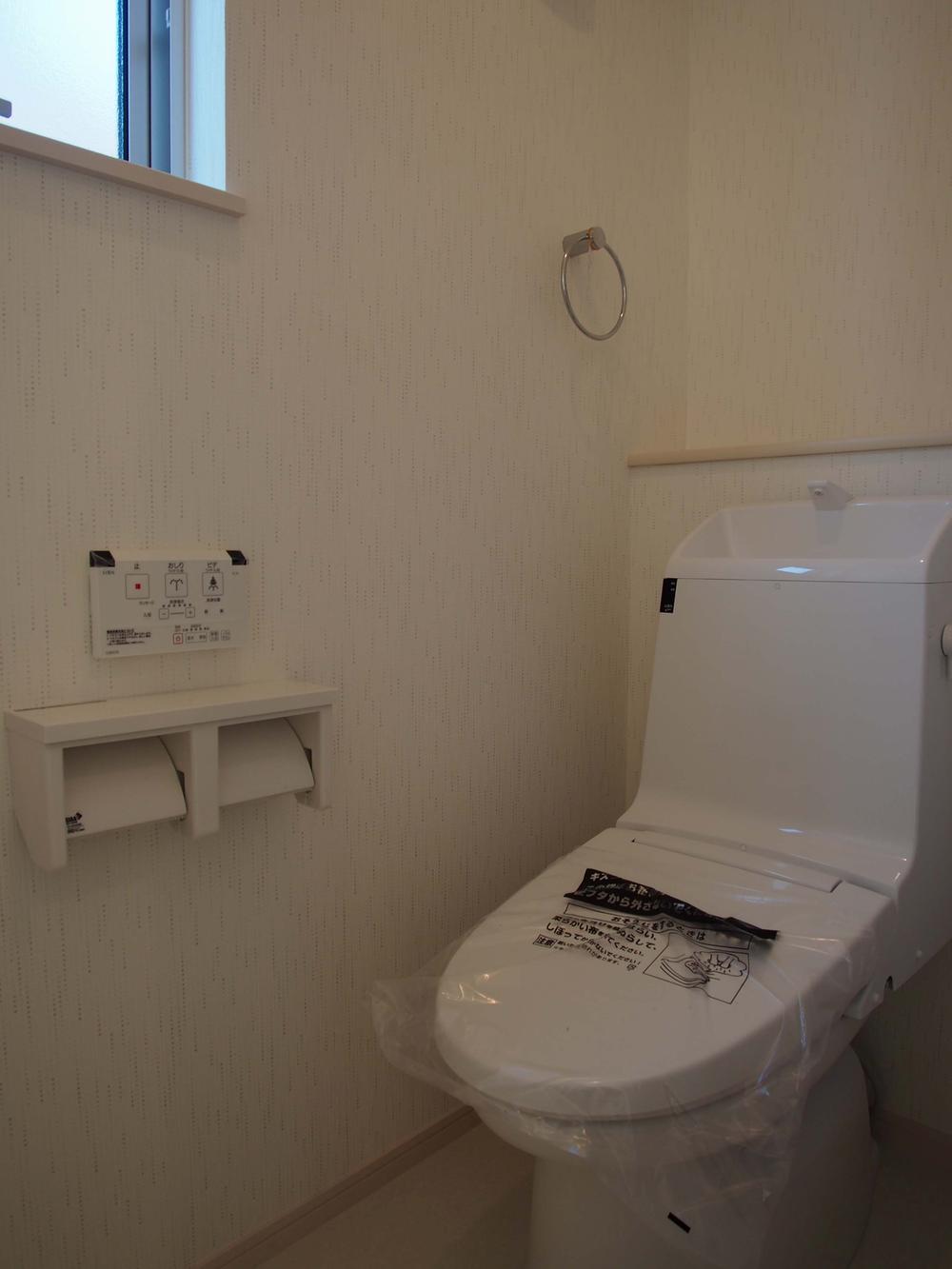 Toilet. With storage is on the wall
