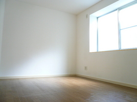 Living and room. South-facing bay window there is a room of