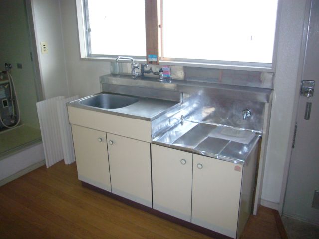 Kitchen. There is a window in the kitchen.