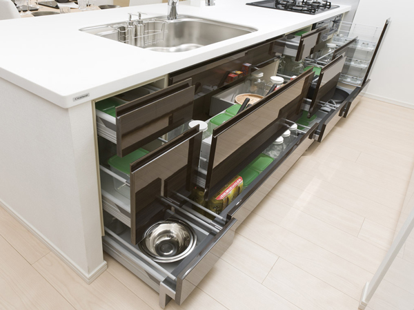 Kitchen.  [Sliding storage] Storage of system kitchens, It can be effectively utilized in the prone cabinet in a dead space, It has adopted a sliding storage.