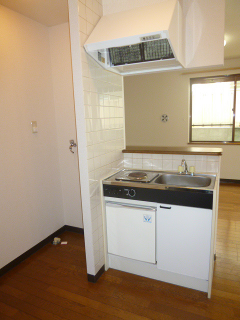 Kitchen. Compact kitchen with refrigerator