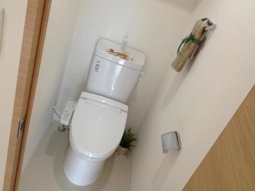 Toilet. top floor, Facing south. Model room published in