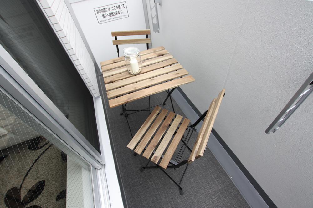 Balcony. top floor, Facing south. Model room published in