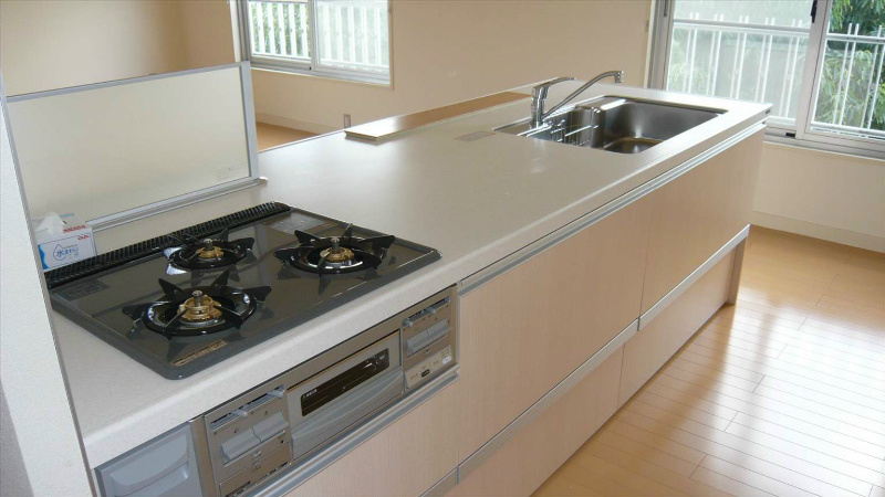 Kitchen. 3-neck system kitchen with a stove