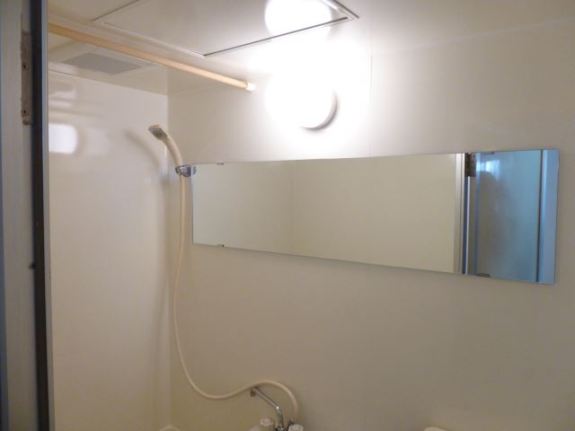Bath. Stylish bathroom with wide mirror unit bus