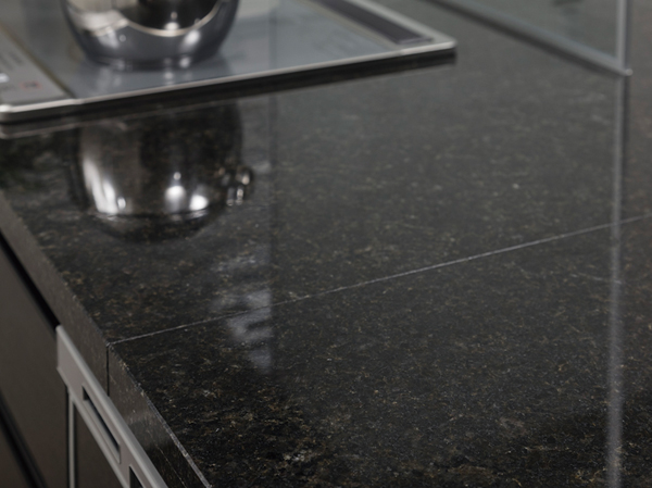 Kitchen.  [Natural granite top plate] Adopt a natural granite top plate to produce a grace to the counter top in the kitchen.