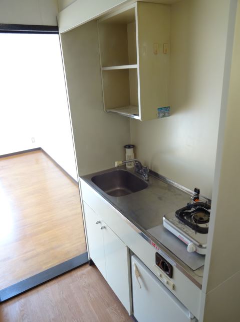 Kitchen. Gas stove, A kitchen with a mini fridge