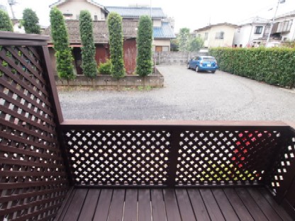 Balcony. Parking visible from the wood deck