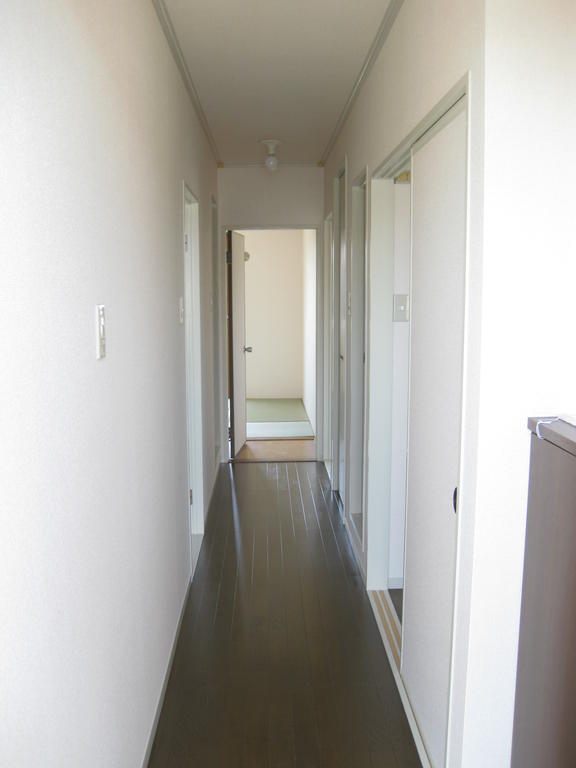 Entrance. It is a photograph of the corridor from the entrance