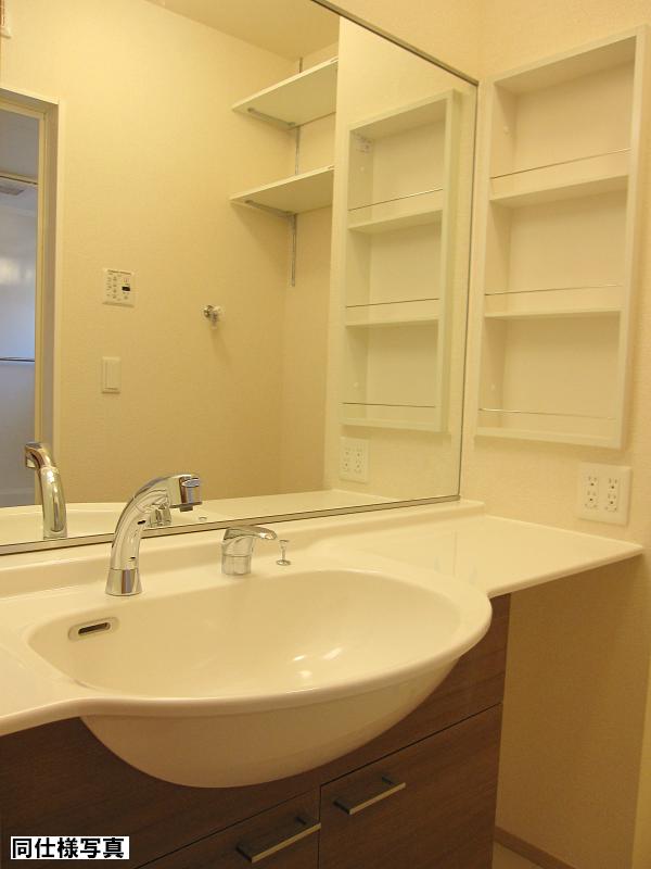 Washroom. Large vanity mirror one side tension