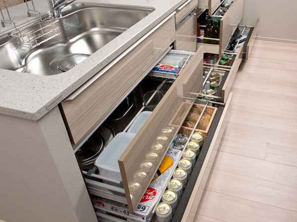 Kitchen.  [All slide storage] Under-counter storage is also taken out of easy to slide drawer thing back.