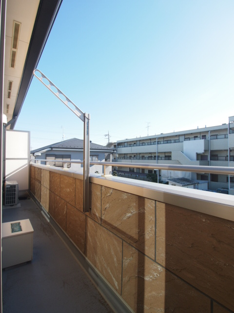 Balcony. South side is in the parking lot day may also view!