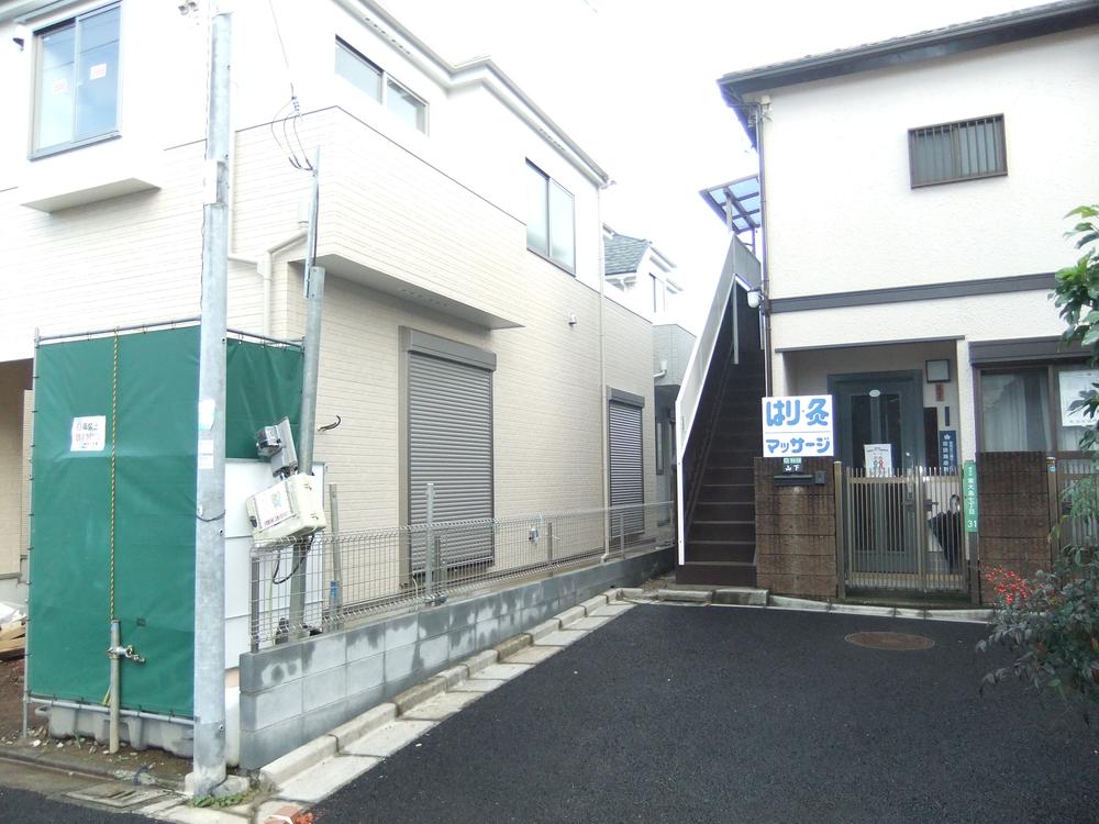 Local photos, including front road. Building 2 front south