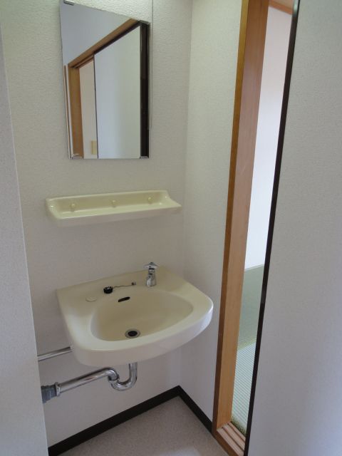 Washroom. Washbasin glad there mini