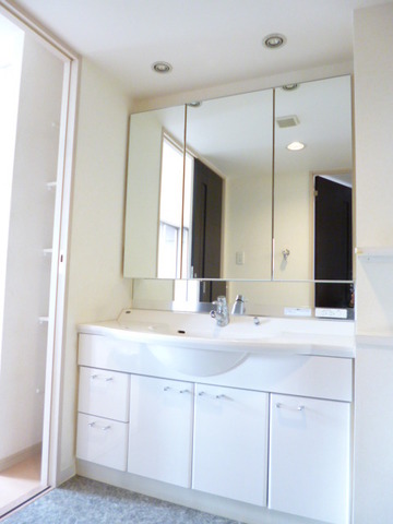 Washroom. It is a wash basin with a triple mirror.