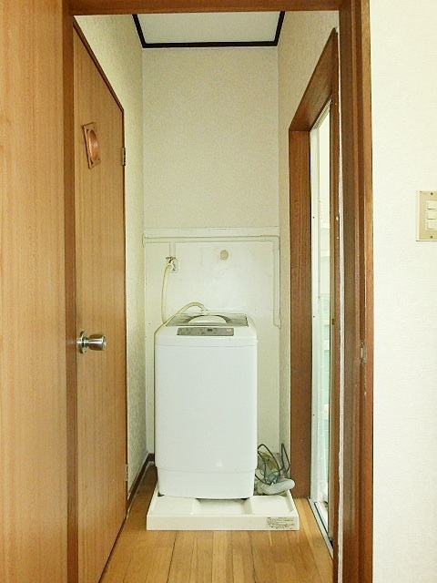 Washroom. Washing machine in the room