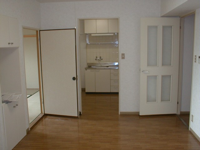 Living and room. Bright rooms with white as well, such as door. 