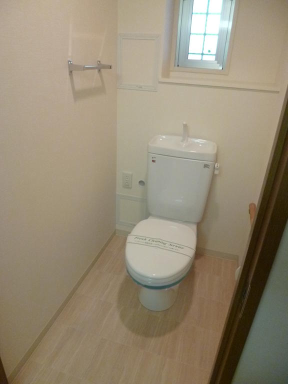 Toilet. Spread of toilet. With handrail.