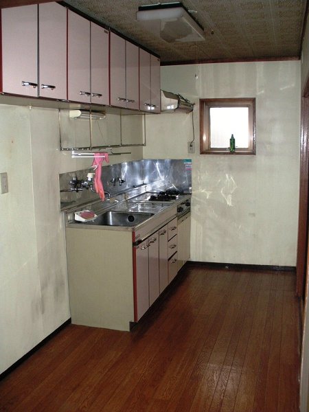 Kitchen. There is also a kitchen storage, There is a small window. 