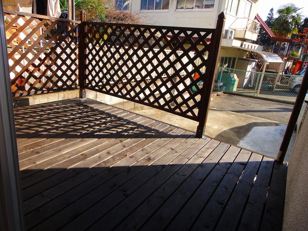 Other. Wood deck that follow from living