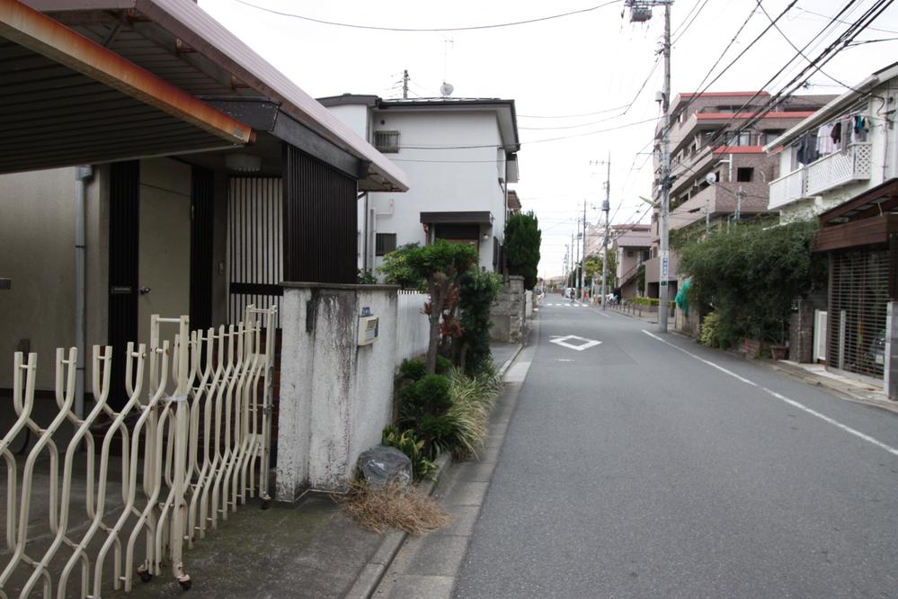 Other. North-west side of the road (about 6m).  A wide road, Garage is also Lele. 