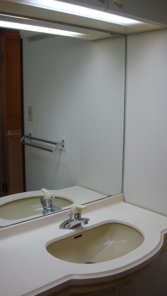 Washroom. Washroom with a large mirror.