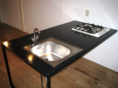 Kitchen. Two-burner gas stove is equipped