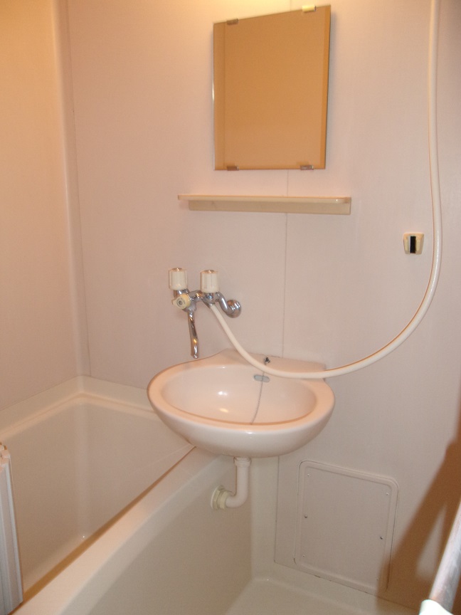 Bath. Bathtub is with washstand.