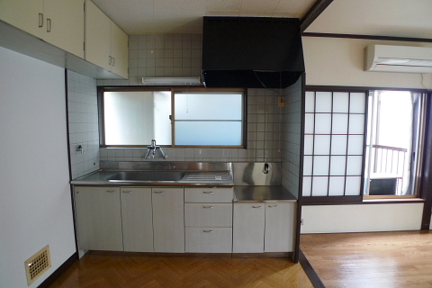 Kitchen. Two-burner stove can be installed. It is convenient there is a cupboard hanging on the left hand side.