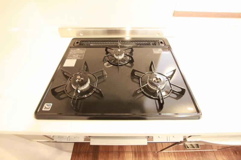 Kitchen. Gas stove with a grill is a three-necked