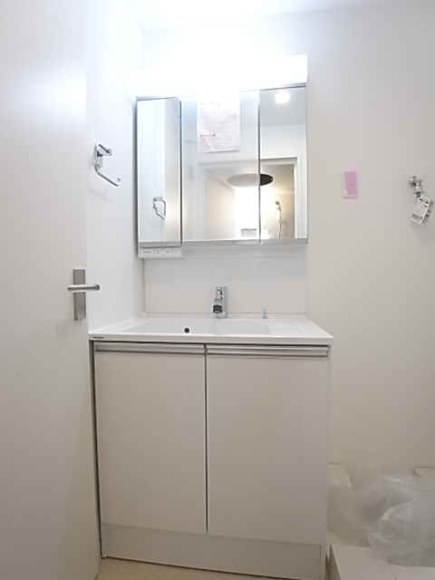 Washroom. Vanity of three-sided mirror