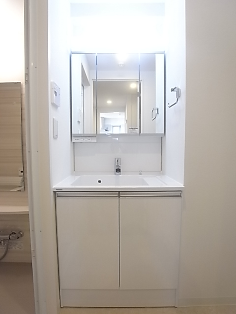 Washroom. Vanity of three-sided mirror