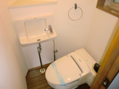 Toilet. Toilet is equipped with Washlet