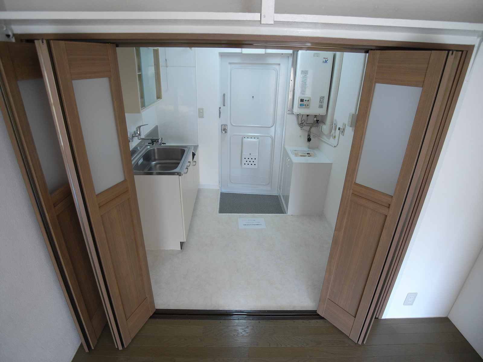 Kitchen. Partition of the kitchen was replaced with a new triple folding door this time