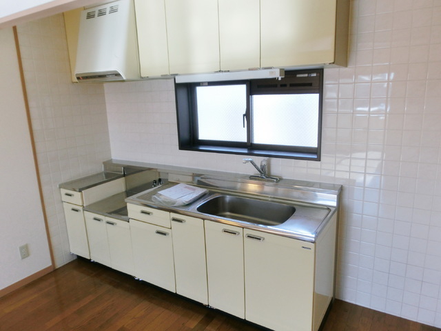 Kitchen. Two-burner gas stove is installed Allowed with window