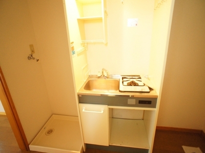 Kitchen. Stove is located 1-neck