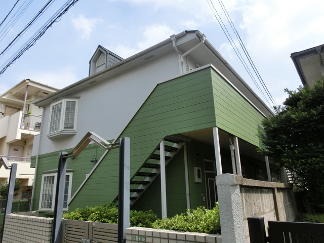 Building appearance. Apartment of the two-story wooden