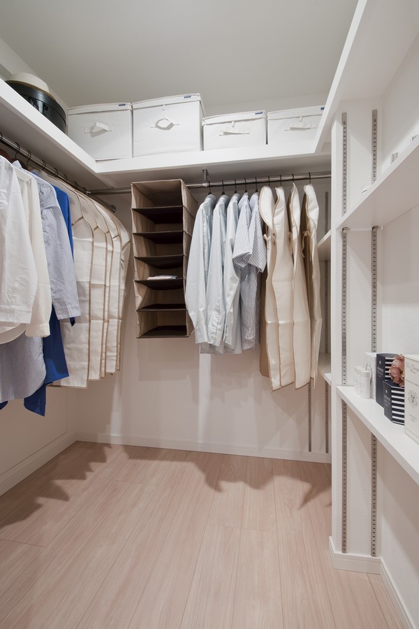 Three directions on a walk-in closet which arranged the storage point