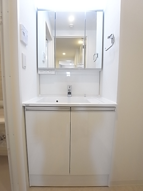 Washroom. Vanity of three-sided mirror