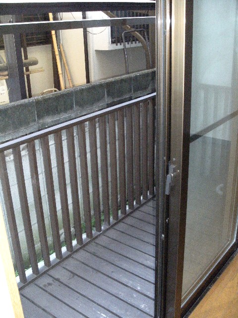 Balcony. Spacious wood deck terrace